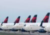 Row of commercial airplanes parked on the tarmac
