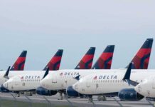 Row of commercial airplanes parked on the tarmac