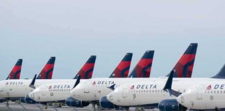 Row of commercial airplanes parked on the tarmac
