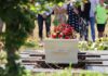 Dad Almost Buried His Teen Daughter Alive White coffin with red flowers at outdoor burial