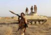 Red Sea Flashpoint – Egypt Steps In soldier carrying rocket-propelled grenade launcher in front of armored vehicle