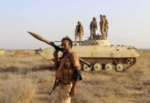 Red Sea Flashpoint – Egypt Steps In soldier carrying rocket-propelled grenade launcher in front of armored vehicle