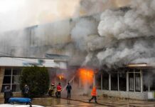 Massive Blast Rips Quaker Oats Plant firefighters respond to large building fire with heavy smoke